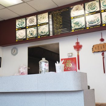 China House - a restaurant counter with a menu on the wall - Chinese Near Me - Milwaukee, Wisconsin