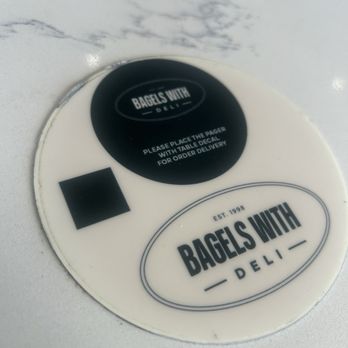 Bagels With Deli - Pager placemat - Breakfast & Brunch Near Me - Delray Beach, Florida Bagels With Deli - Pager placemat - Breakfast & Brunch Near Me - Delray Beach, Florida