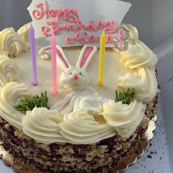 Mim's Bakery - a birthday cake with candles - Bakeries Near Me - Chico, California