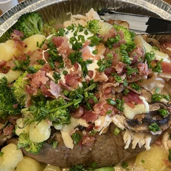 SpudToddos - Baked potato with turkey and gravy, cheese, curds, onions, mushrooms, broccoli, sour cream, chives, and bacon. - Gluten-Free Near Me - West Jordan, Utah