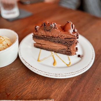 Sage & Salt Bistro - a piece of chocolate cake and ice cream - New American Near Me - Winston-Salem, North Carolina