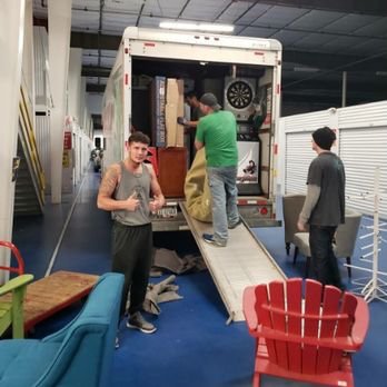 We Haul Movers Direct - Guys working hard - Movers Near Me