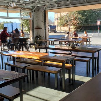 Industry - Dining area with patio and live music on weekends - New American Near Me - San Marcos, Texas