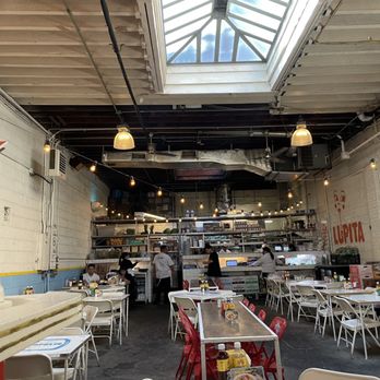 Tacombi - The inside of the restaurant has a very industrial look and is very spacious. - Mexican Near Me - New York, New York Tacombi - The inside of the restaurant has a very industrial look and is very spacious. - Mexican Near Me - New York, New York