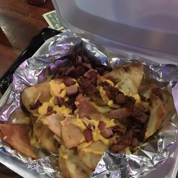Hooks Bar & Grill - Sad excuse for "nachos". These aren't even corn chips, they are pita chips with machine made nacho cheese and Taylor Ham. - Sports Bars Near Me - Seaside Heights, New Jersey Hooks Bar & Grill - Sad excuse for "nachos". These aren't even corn chips, they are pita chips with machine made nacho cheese and Taylor Ham. - Sports Bars Near Me - Seaside Heights, New Jersey
