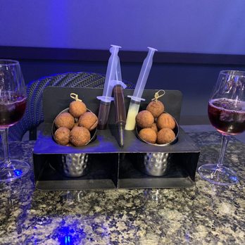 Topgolf - Sangria, donuts with chocolate syrup, jelly, and white chocolate to inject into them - New American Near Me - Birmingham, Alabama