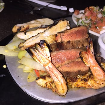Uncle Julio's - This is what a $45 plate of meat looks like - steak and chicken fajitas for two, add shrimp (for $10). - Mexican Near Me - Gainesville, Virginia Uncle Julio's - This is what a $45 plate of meat looks like - steak and chicken fajitas for two, add shrimp (for $10). - Mexican Near Me - Gainesville, Virginia