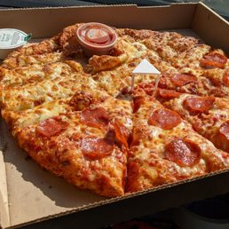 a pepperoni pizza in a box