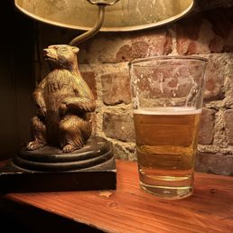 Golden Gopher near billiards table