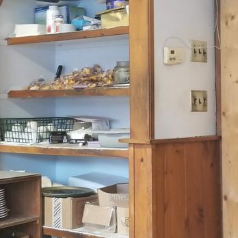 Shanghai Garden - a kitchen with a refrigerator and shelves - Chinese Near Me - Springfield, Vermont