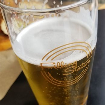 The Filling Station - a glass of beer and a sandwich - American Near Me - Bellingham, Washington