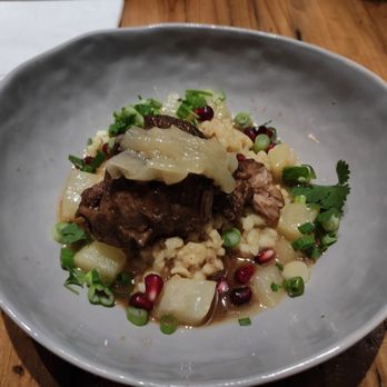 Mr Pollo - Braised lamb, simmered onion, green onions,cilantro, pomegranate and Yukon? - New American Near Me - San Francisco, California