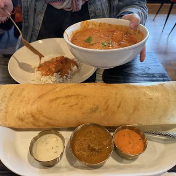 Roaring Indian Plates & Pours - Butter Chicken over the rice, and Masla (potato) Dosa, white (is coconut chutney, brown (sombar), red (tomato chutney)! - Indian Near Me - Maple Valley, Washington Roaring Indian Plates & Pours - Butter Chicken over the rice, and Masla (potato) Dosa, white (is coconut chutney, brown (sombar), red (tomato chutney)! - Indian Near Me - Maple Valley, Washington