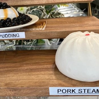Dong Tea - pork steamed dumpling (plastic food example) and pudding - Bubble Tea Near Me - Lakeland, Florida