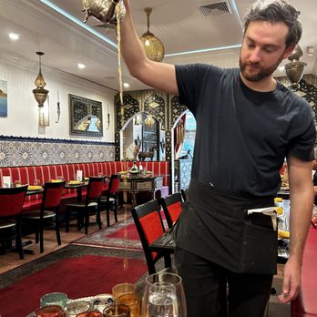 Casablanca - Pouring the Moroccan Mint Tea - Moroccan Near Me - East Brunswick, New Jersey Casablanca - Pouring the Moroccan Mint Tea - Moroccan Near Me - East Brunswick, New Jersey