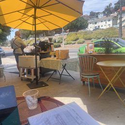 Barista and sidewalk tables.