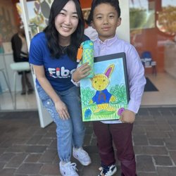Fibo Kids Art Academy - A Lil picsaso (prek-1st) student at Tustin sharing his work inspired by Beatrix Potter's rabbit! markers and chalk pastels