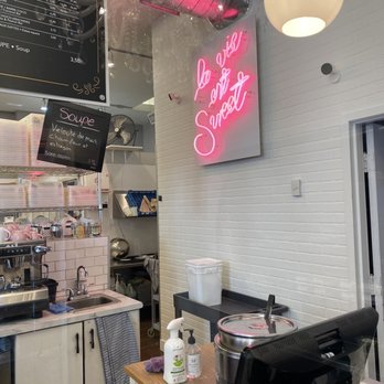 Cookie Stéfanie - a view of a kitchen with a neon sign above the counter - Gluten-Free Near Me - Montreal, Quebec