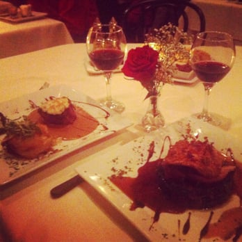 La Petite Maison - Le petit filet with gratin potatoes on the left and duck breast with pate ravioli and spinach on the right - French Near Me - Atlanta, Georgia