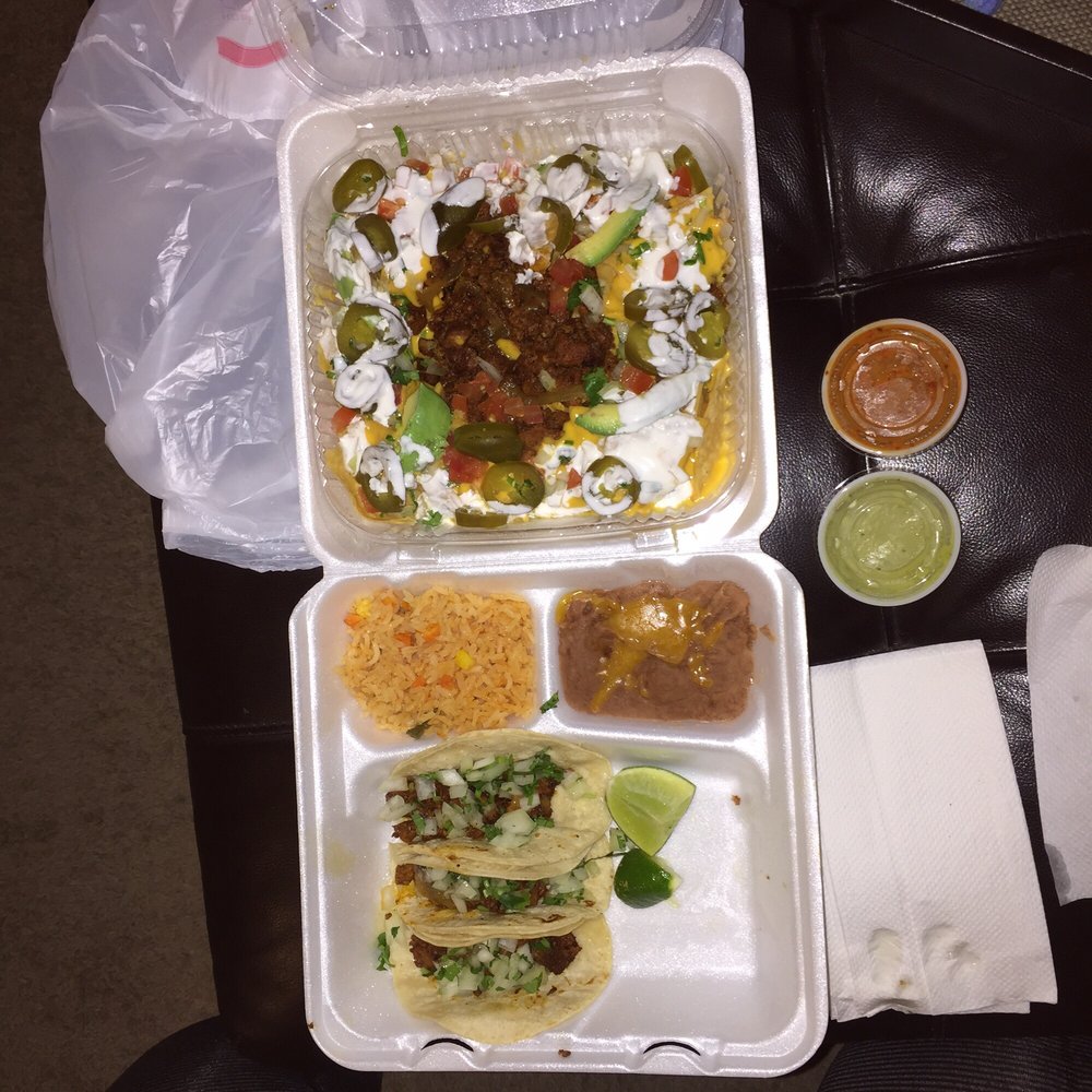 Fiesta nachos with Al pastor on top. And the taco plate which comes with three tacos, rice, and beans. Fiesta nachos with Al pastor on top. And the taco plate which comes with three tacos, rice, and beans.