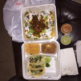 Fiesta nachos with Al pastor on top. And the taco plate which comes with three tacos, rice, and beans. Fiesta nachos with Al pastor on top. And the taco plate which comes with three tacos, rice, and beans.