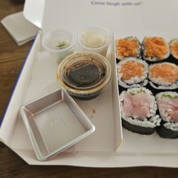 Three rolls to go. $17. Spicy tuna (sucked,) salmon (good,) yellowtail scallion (tasty)