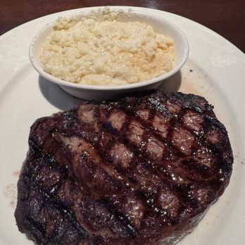 Cherokee Grill - 12 oz Ribeye, medium, with Tennessee Blue Cheese Grits - Steakhouses Near Me - Gatlinburg, Tennessee Cherokee Grill - 12 oz Ribeye, medium, with Tennessee Blue Cheese Grits - Steakhouses Near Me - Gatlinburg, Tennessee