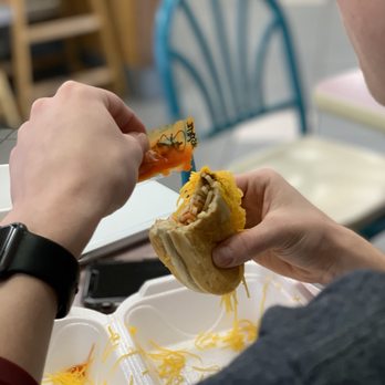 Empress Chili - a person eating a sandwich - American Near Me - Alexandria, Kentucky Empress Chili - a person eating a sandwich - American Near Me - Alexandria, Kentucky