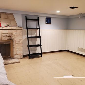 Ciprian Hardwood Flooring - Before the vinyl is installed over the existing tile floor in the basement... - Flooring Near Me - Chicago, Illinois