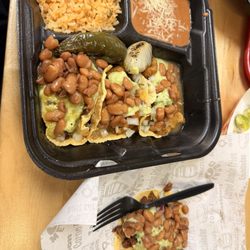 Salsitas Tacos Al Carbon - Taco plate with asada and chicharrón tacos and a tripa taco on the side