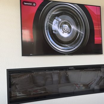 Tv Mounting 4 Less - 65" TV mounted above an electric fireplace. - TV Mounting Near Me Tv Mounting 4 Less - 65" TV mounted above an electric fireplace. - TV Mounting Near Me