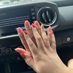 Wind Nails Salon & Spa - The sparkling pink is my mom nails and my nails is red and my ring finger is gold