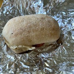 Lighthouse Variety & Deli - Breakfast sandwich egg, cheese, bacon on telera roll.
