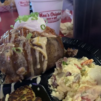 Moe's Original Bar B Que - Loaded BBQ Baked potato. Side of potato salad and cornbread. - Barbeque Near Me - Foley, Alabama