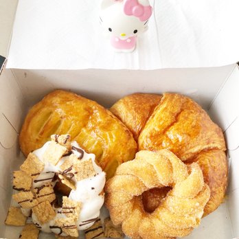 Redondough - a box of doughnuts with a hello kitty figurine in the background - Cafes Near Me - Redondo Beach, California