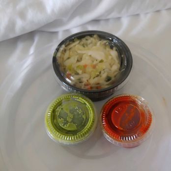 Oren's Hummus - Coleslaw type salad and 2 very spicy sauces. Not sure exactly what they are, - Mediterranean Near Me - Cupertino, California
