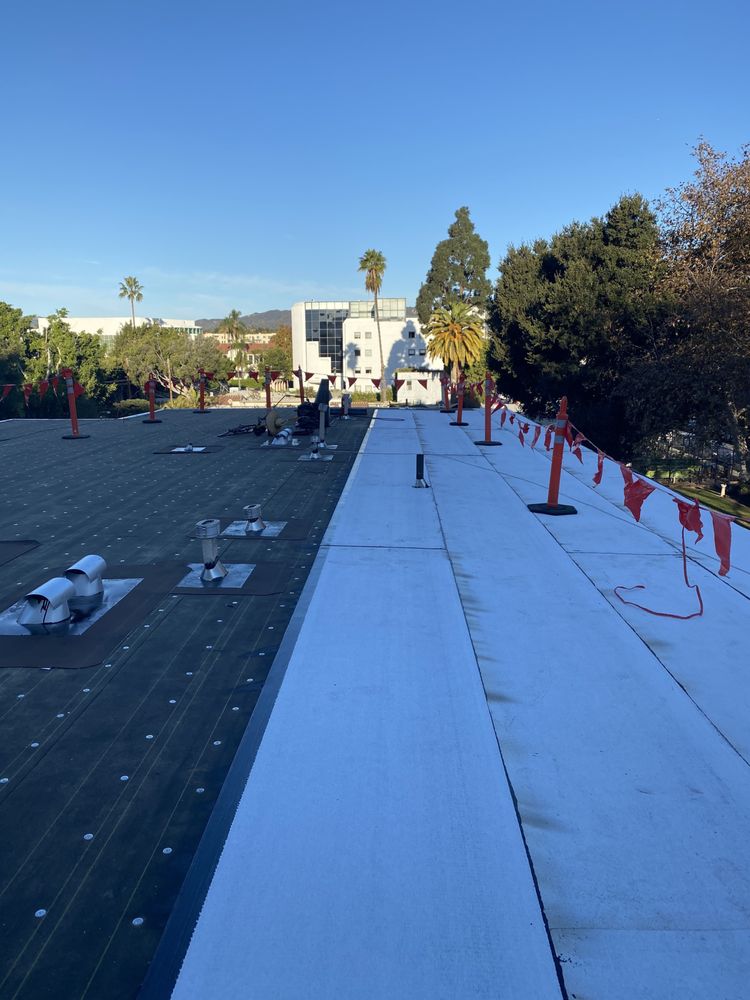 Slide of Green Ladder Roofing