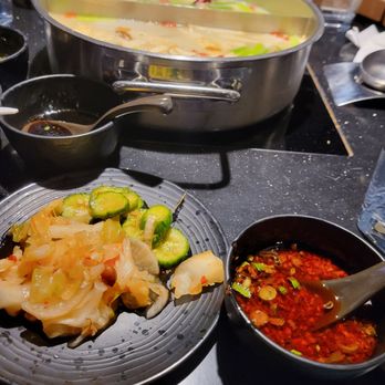 Happy Lamb Hot Pot - kimchi and sweet&sour cucumber. - Hot Pot Near Me - Seattle, Washington