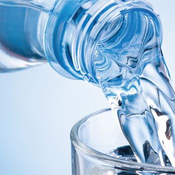 Big Y Express - a bottle of water being poured into a glass - Gas Stations Near Me - Springfield, Massachusetts