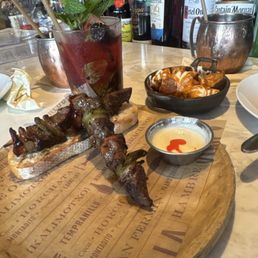 Steak Pintxo papá Patatas Bravas n a mojito black berry
