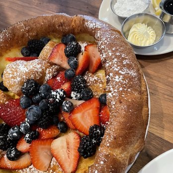 Plums Cafe - Dutch Baby with mixed berries - Breakfast & Brunch Near Me - Costa Mesa, California