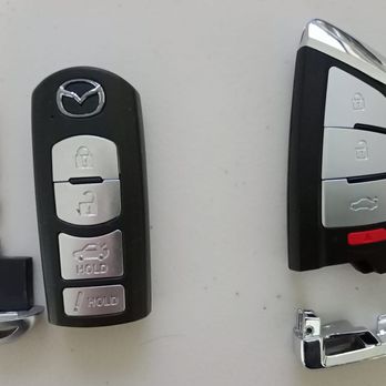 Golden Key Locksmith - In the attached picture: My original fob with key on the left; her crappy remote with NO key on the right and ONLY 2 out of 4 buttons work. - Keys & Locksmiths Near Me Golden Key Locksmith - In the attached picture: My original fob with key on the left; her crappy remote with NO key on the right and ONLY 2 out of 4 buttons work. - Keys & Locksmiths Near Me