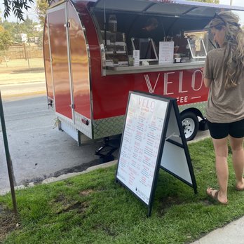 Velo Coffee - a woman standing in front of a velo coffee truck - Coffee & Tea Near Me - Los Angeles, California Velo Coffee - a woman standing in front of a velo coffee truck - Coffee & Tea Near Me - Los Angeles, California