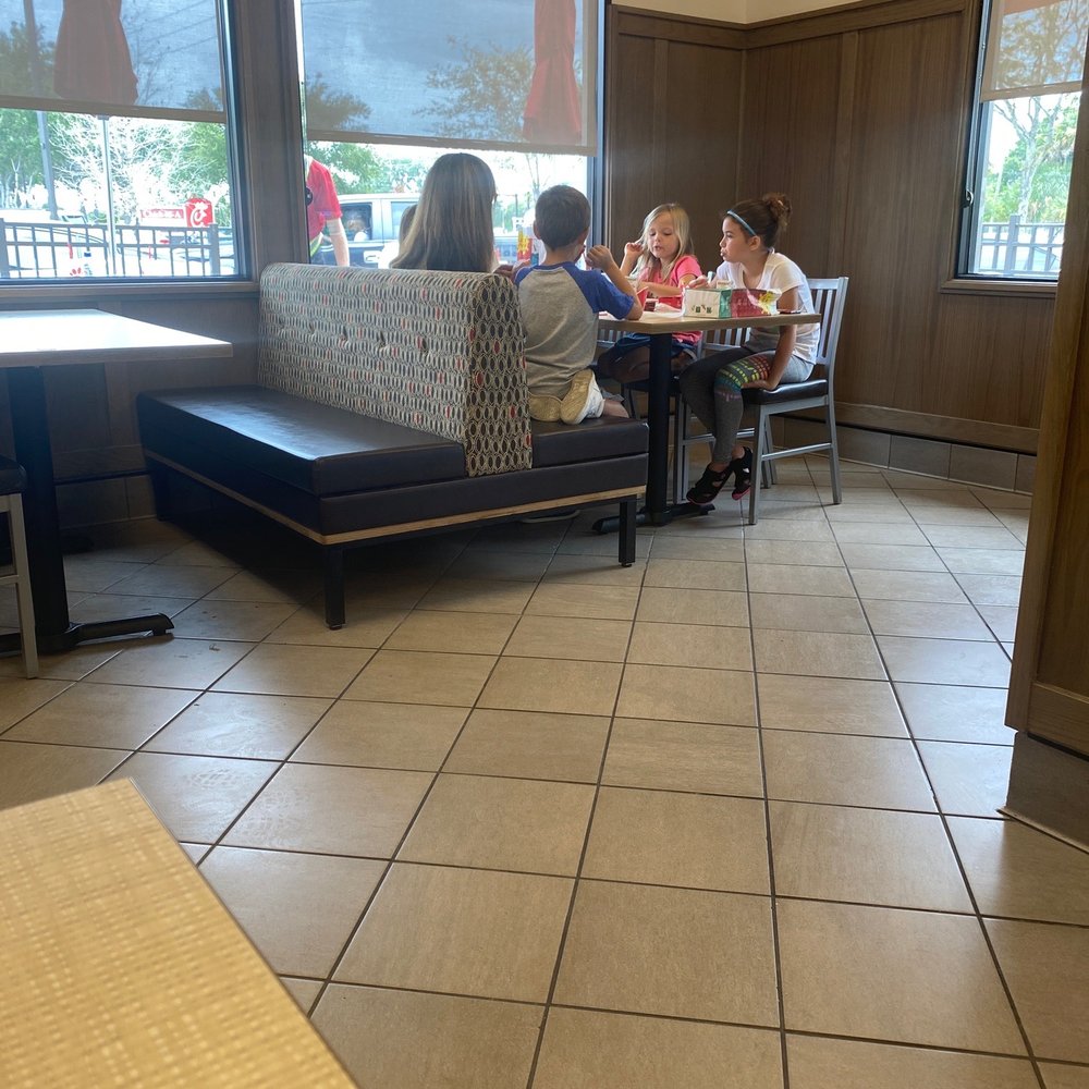 Chick-fil-A - ows people sitting at a table in a restaurant - Fast Food Near Me - Trinity, Florida Chick-fil-A - ows people sitting at a table in a restaurant - Fast Food Near Me - Trinity, Florida