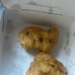 McDonald's - four piece, chicken nugget happy meal and two of the chicken nuggets were hard  as a rock.