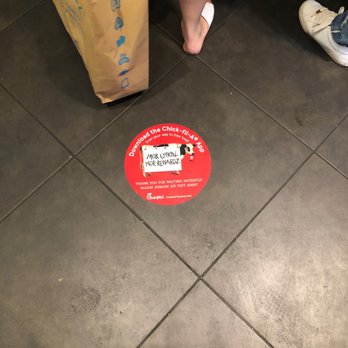 Chick-fil-A - ows a person standing on the floor next to a bag of food - Salad Near Me - Freehold, New Jersey