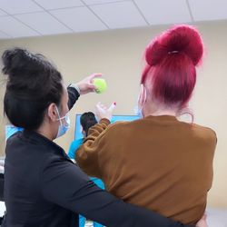 Encompass Health Rehabilitation Hospital of Tustin - Working with her therapist