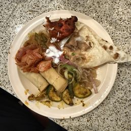 Garlic Naan Chicken tandoori Spring roll Raita Kimchi Fried vegetables Rice topped with lentil soup Garlic Naan Chicken tandoori Spring roll Raita Kimchi Fried vegetables Rice topped with lentil soup