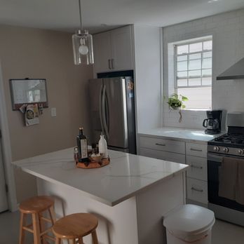 AJ Custom designs - a kitchen with stainless steel appliances - Countertop Installation Near Me - Chicago, Illinois