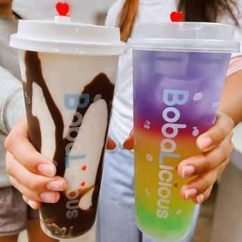BobaLicious - a woman holding a cup of ice cream and a drink - Bubble Tea Near Me - Bryant, Arkansas BobaLicious - a woman holding a cup of ice cream and a drink - Bubble Tea Near Me - Bryant, Arkansas